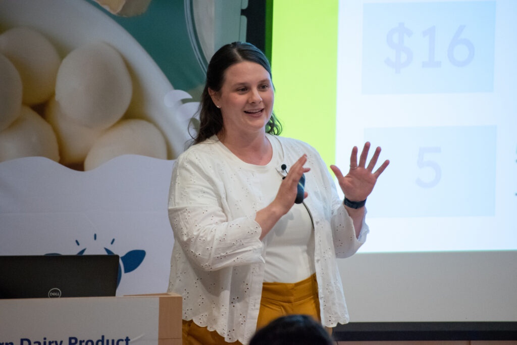 Photo: Laura Mack pitches lu.lu Ice Cream at the Northeastern Dairy Product Innovation Competition in 2023.